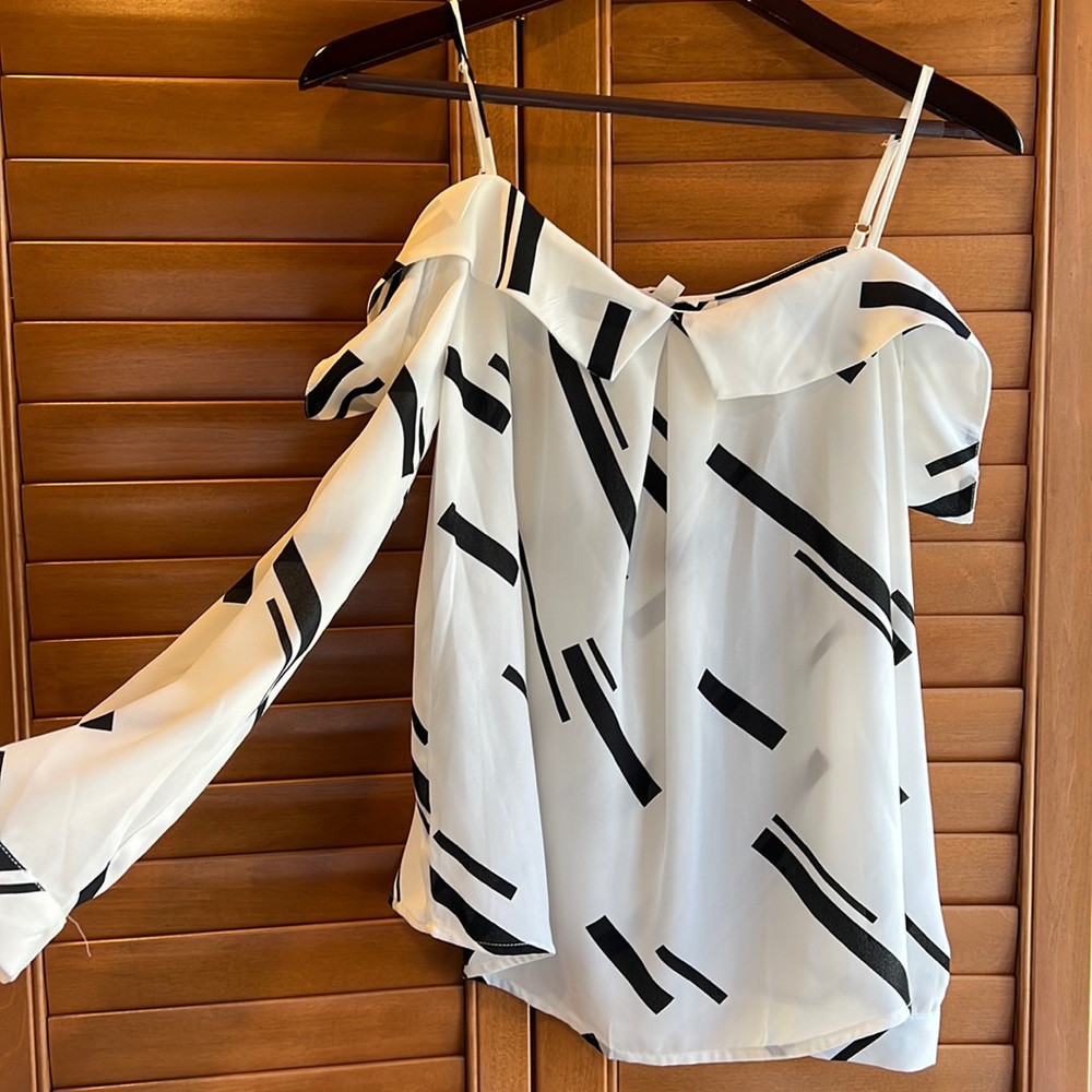 Fun black and white blouse with cut out shoulder